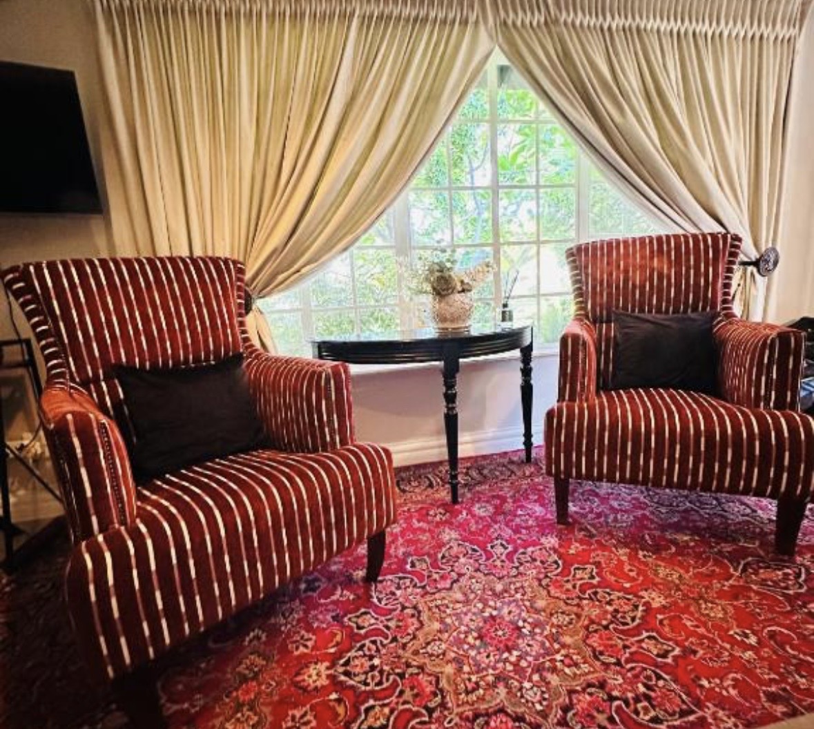 Queen room with garden view seating at Cherry Nest