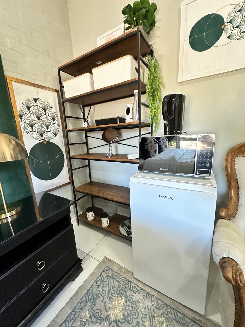Room 10 bar fridge, microwave and styled shelving