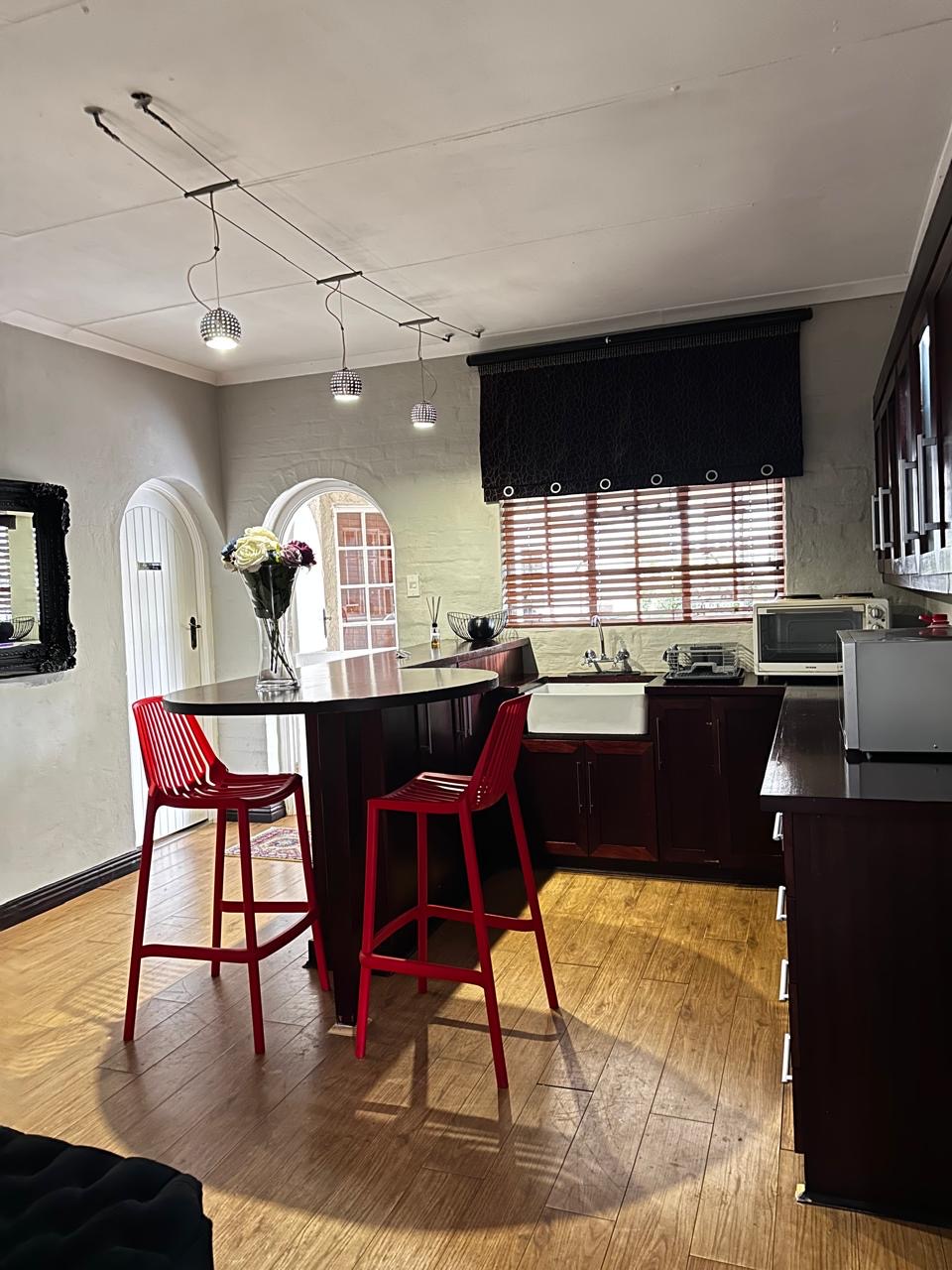 Guest kitchenette with breakfast bar near Room 8