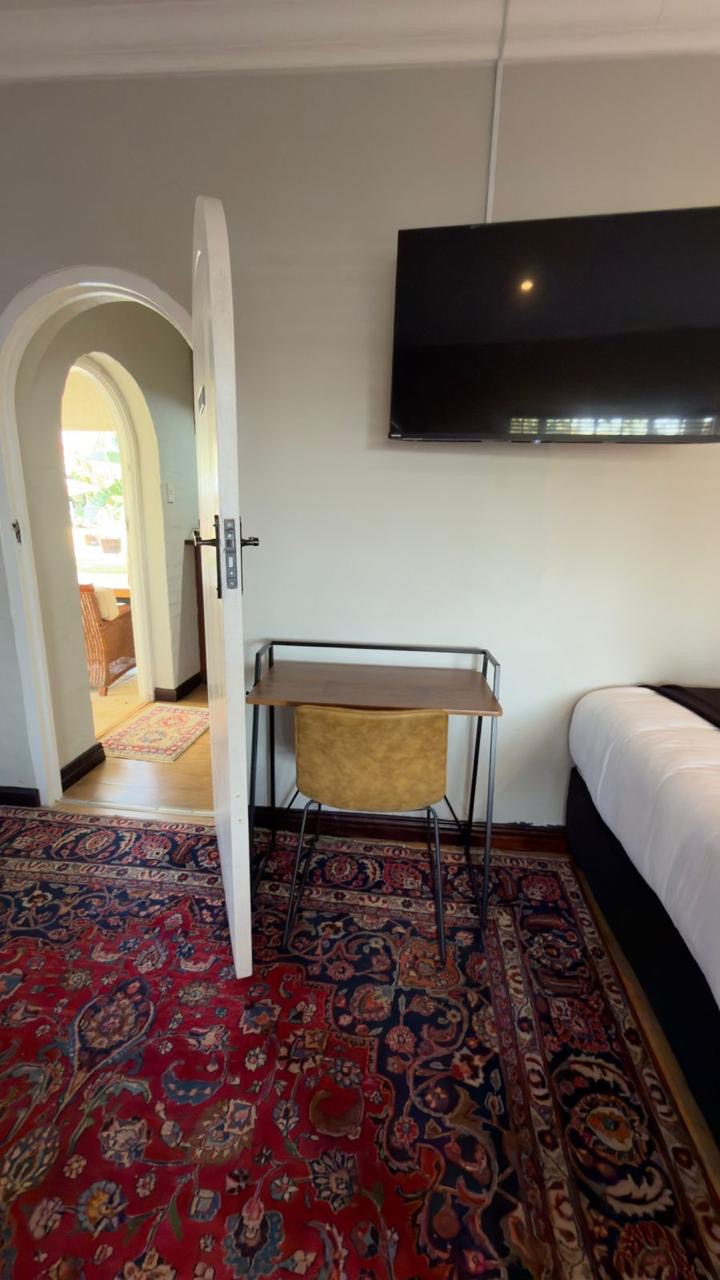 Room 9 desk, chair and wall-mounted TV