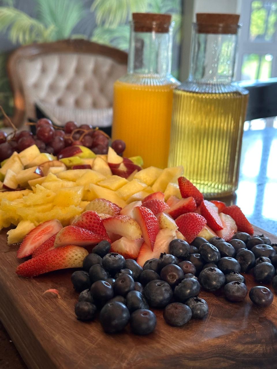 Fresh fruit platter with berries and juice